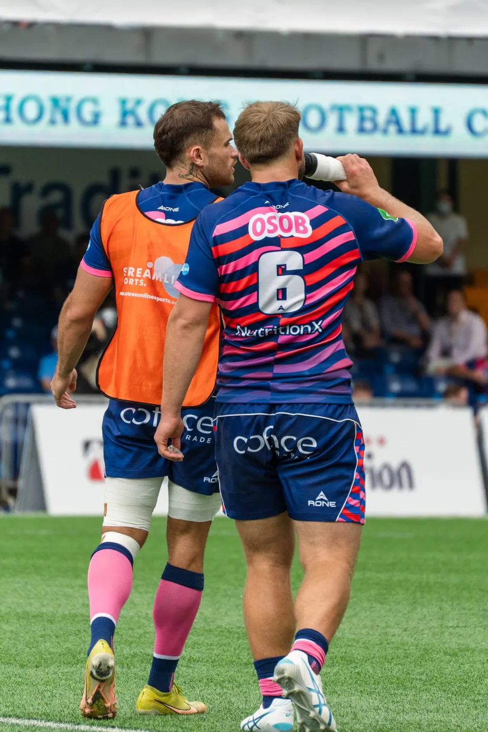 OSOB number 6 watches play from the touchline
