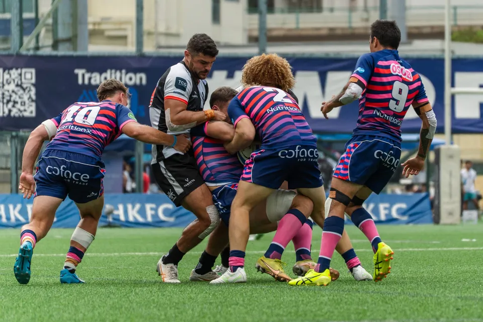 OSOB players drive into a ruck