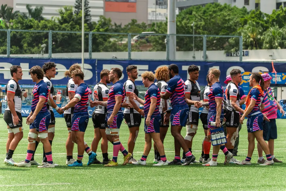 Both teams shake hands at full time