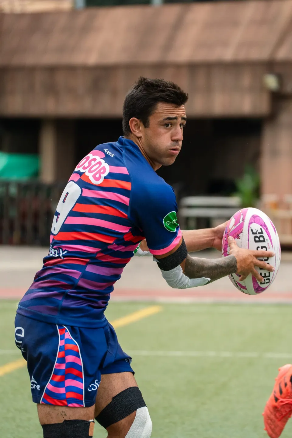 An OSOB scrum-half looks to pass