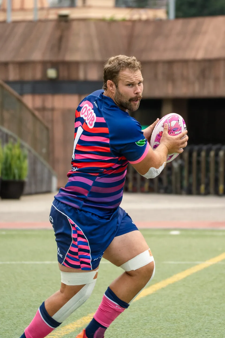 An OSOB player runs with the ball