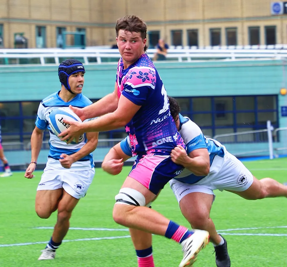 An OSOB ball carrier takes on a tackler