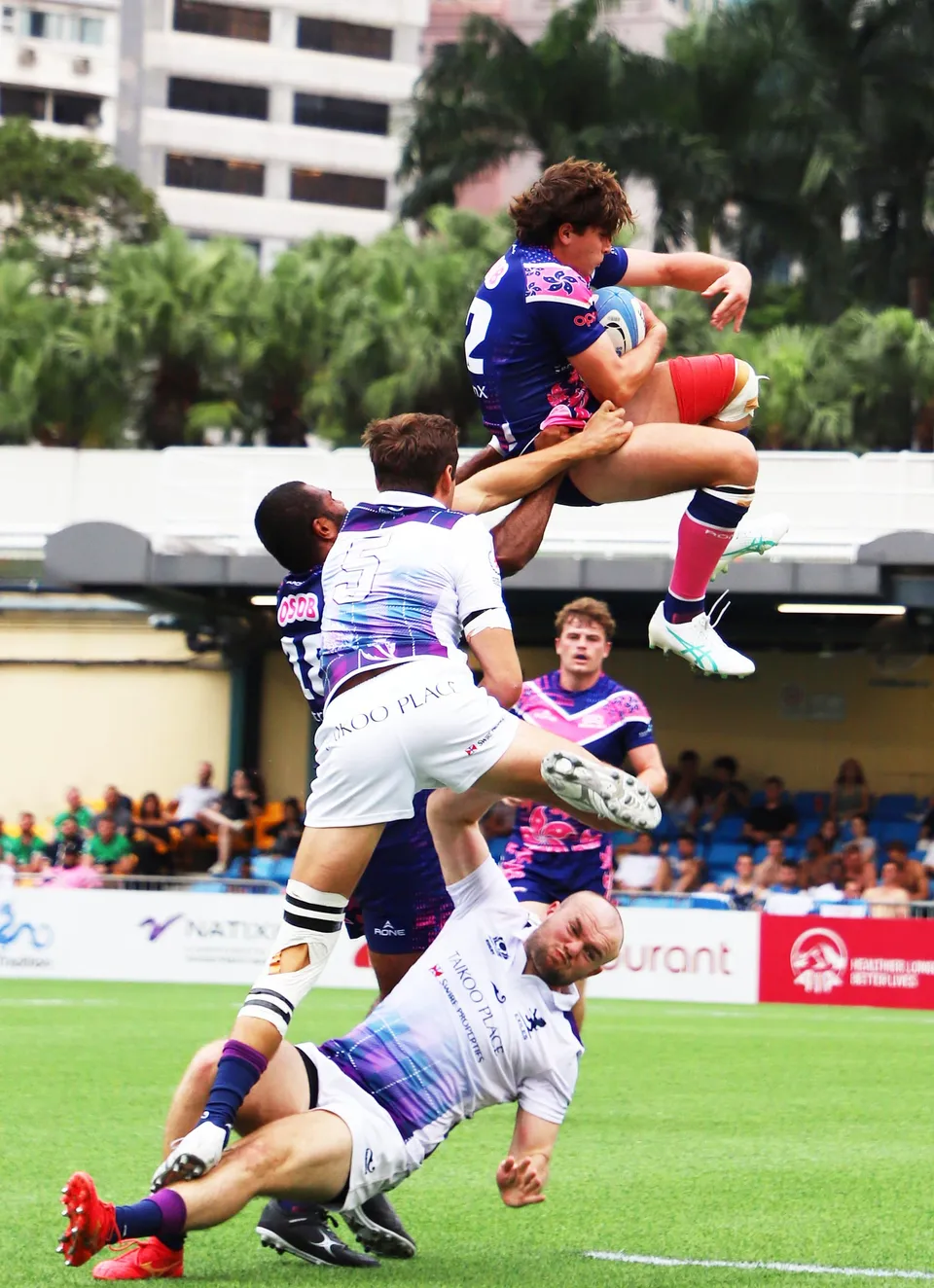An OSOB player hurdles a tackle