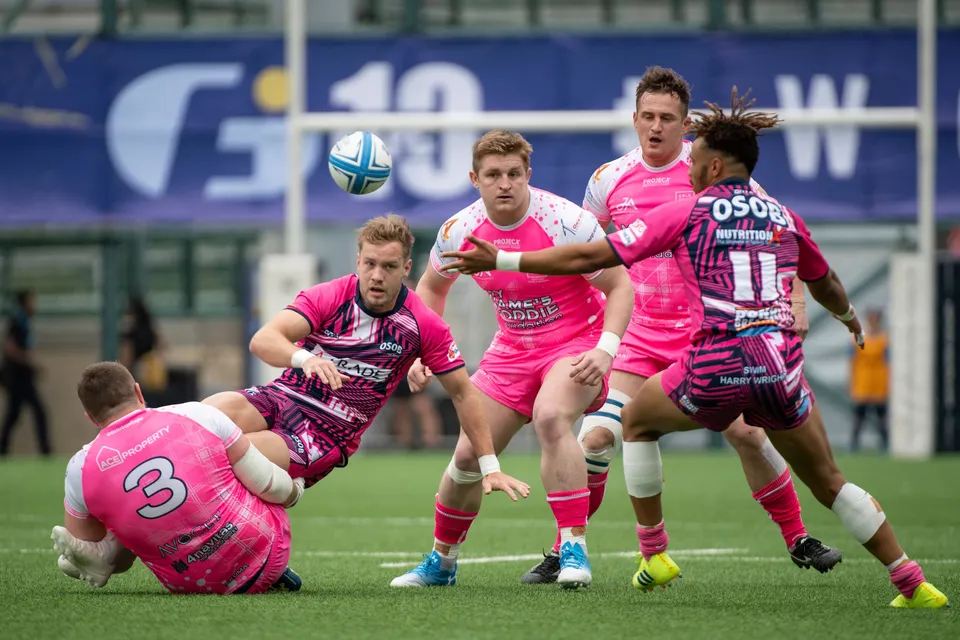 Ball floats above the heads as OSOB number 11 reaches across, a Waterboys number 3 on the ground in plain pink