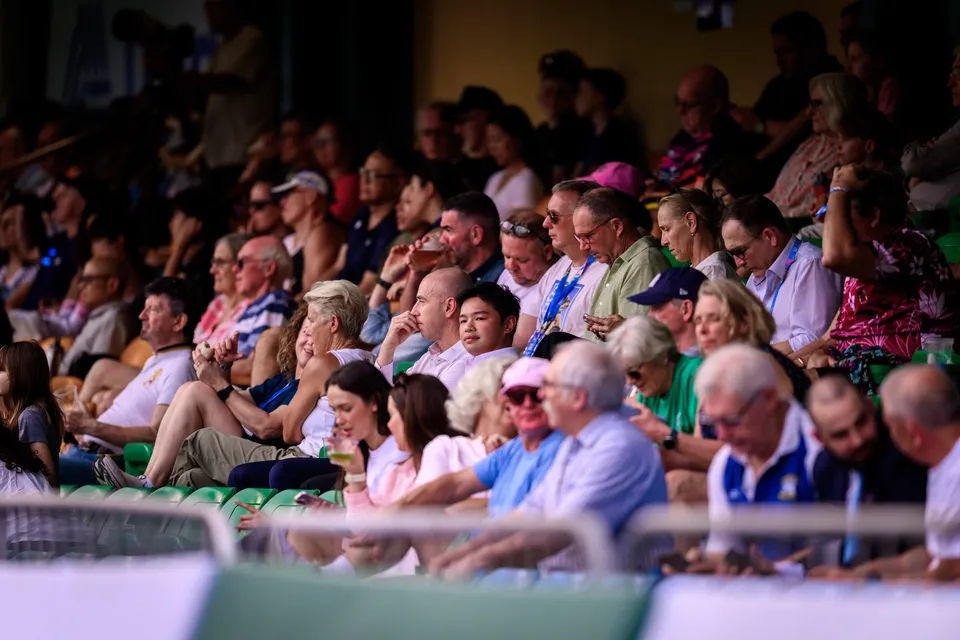 Crowd of spectators in the stand, shown softly out of focus, watching play at the 2026 HKFC 10s