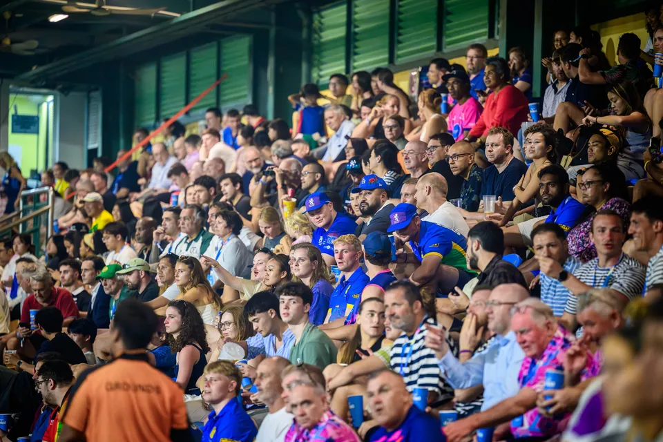 Tightly packed crowd in the stands, many in blue shirts and caps, watching a match at the 2026 HKFC 10s