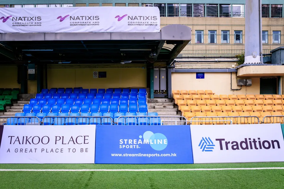Samurai, Taikoo Place and Streamline Sports boards before a blue and green stand under Natixis banners