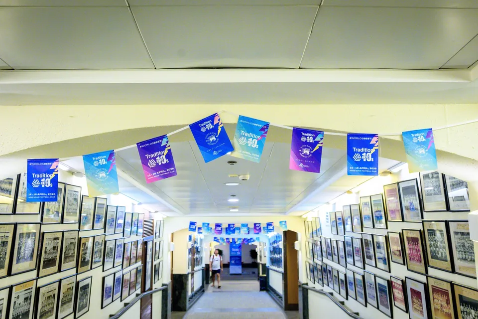 Welcome sign for sponsors, members and general admission in the club lobby between two plants and wall plaques